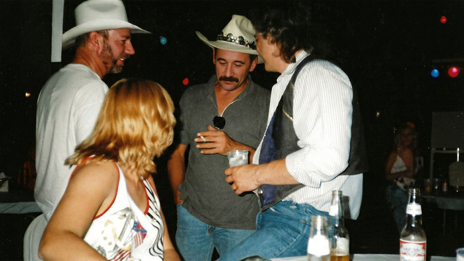 Bob Barnett, Inge Walton (seated), Aaron Tippen, Brian Walton drinking it up after the concert, Frankfurt, Germany, 1997